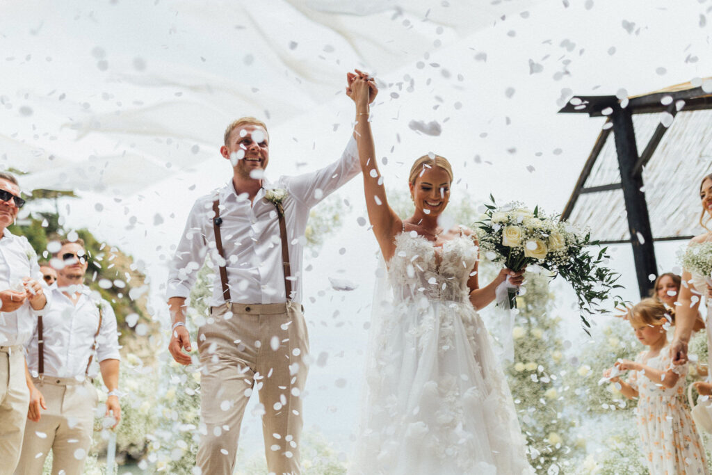 Wedding couple with confetti