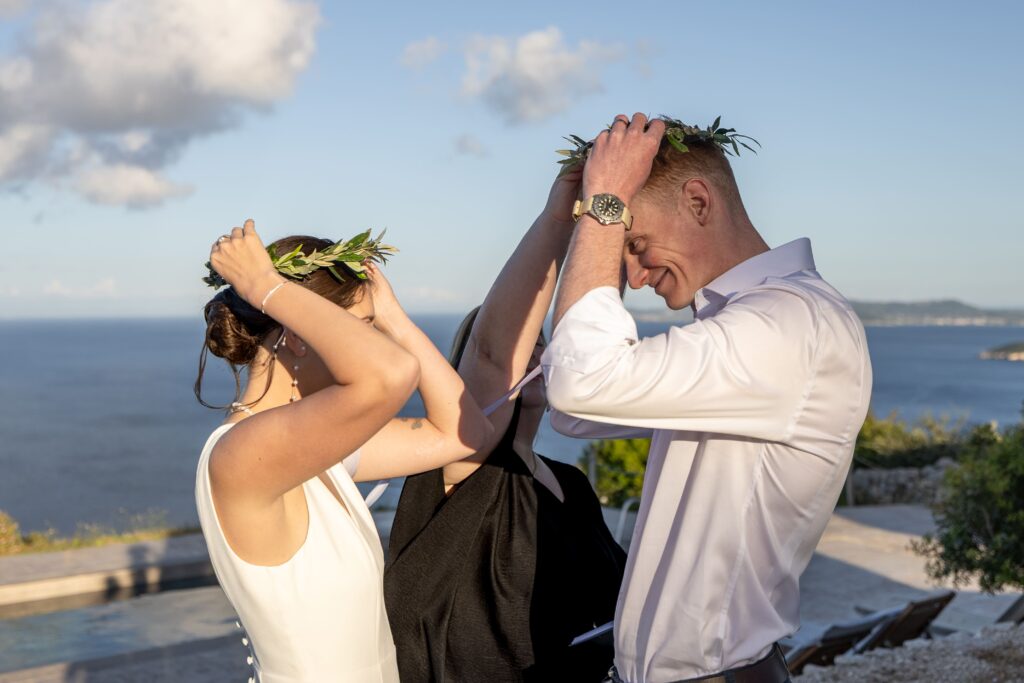wedding couple with olive branch crowns